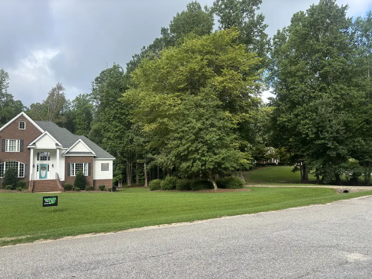 Shaded lawn maintained under mature hardwoods